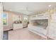 Bright bedroom with bunk beds, and floral wallpaper, a dresser and large windows at 7805 Crooked Creek Church Rd, Monroe, NC 28110