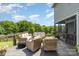 Outdoor deck with comfortable seating overlooking the well-manicured backyard at 7805 Crooked Creek Church Rd, Monroe, NC 28110