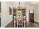 Elegant dining room featuring hardwood floors, a decorative chandelier, and ample seating at 7805 Crooked Creek Church Rd, Monroe, NC 28110