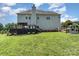 Back of the house with a spacious deck and landscaped yard, perfect for outdoor living at 7805 Crooked Creek Church Rd, Monroe, NC 28110