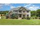Charming home featuring stone accents, a landscaped front yard, and inviting curb appeal at 7805 Crooked Creek Church Rd, Monroe, NC 28110
