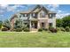 Charming home featuring stone accents, a landscaped front yard, and inviting curb appeal at 7805 Crooked Creek Church Rd, Monroe, NC 28110