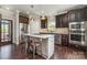 Modern kitchen with stainless steel appliances, a center island, and dark cabinetry at 7805 Crooked Creek Church Rd, Monroe, NC 28110
