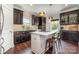 This expansive kitchen features a large center island with seating and custom cabinetry at 7805 Crooked Creek Church Rd, Monroe, NC 28110
