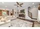 Open-concept living room with wood accents, a neutral palette, and staircase access at 7805 Crooked Creek Church Rd, Monroe, NC 28110