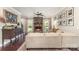 Cozy living room featuring a stone fireplace, neutral-toned furniture, and ample natural light at 7805 Crooked Creek Church Rd, Monroe, NC 28110