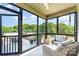 Relaxing screened porch with comfortable seating, a ceiling fan, and a beautiful view at 7805 Crooked Creek Church Rd, Monroe, NC 28110