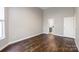 A large bedroom featuring hardwood floors and a view into the ensuite bathroom at 795 Peninsula Dr, Davidson, NC 28036