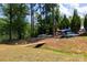 Direct canoe access via wooden bridge, creating a seamless path to water adventures in this serene setting at 795 Peninsula Dr, Davidson, NC 28036