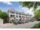 Multi-story apartment building with private balconies and ample parking in front at 795 Peninsula Dr, Davidson, NC 28036