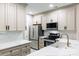 Updated kitchen with stainless steel appliances, custom cabinets, and white countertops at 795 Peninsula Dr, Davidson, NC 28036