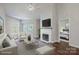 Bright living room with fireplace, neutral tones, hardwood floors, and access to balcony at 795 Peninsula Dr, Davidson, NC 28036