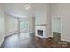 Spacious living room featuring hardwood floors, fireplace, and balcony access at 795 Peninsula Dr, Davidson, NC 28036
