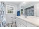 Bathroom features a white vanity with a large mirror and a window providing natural light at 80 Lecline Ne Cir, Concord, NC 28025