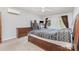 A comfortable bedroom with a ceiling fan, dresser, and a bed with storage beneath at 80 Lecline Ne Cir, Concord, NC 28025