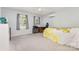 A sunlit bedroom with a bed, desk, and A/C unit for a perfect blend of comfort and work at 80 Lecline Ne Cir, Concord, NC 28025