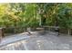 Spacious wooden deck offers outdoor dining and grilling amidst a lush, wooded setting at 80 Lecline Ne Cir, Concord, NC 28025
