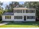 Charming two-story home featuring black shutters, a well-manicured lawn, and a welcoming front entrance at 80 Lecline Ne Cir, Concord, NC 28025