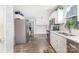 Spacious kitchen featuring stainless steel appliances, white cabinets, and wood-look floors at 80 Lecline Ne Cir, Concord, NC 28025