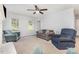 Comfortable living room with a ceiling fan, carpeted floors, and a cozy seating area at 80 Lecline Ne Cir, Concord, NC 28025