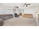 Spacious living room with three ceiling fans, neutral carpeting, and comfortable sofas at 80 Lecline Ne Cir, Concord, NC 28025