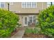 Backyard patio area surrounded by green foliage, offering privacy at 8232 Sunset Hill Rd # Th88, Waxhaw, NC 28173