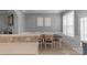 Dining room features a wood table and a view into the living room at 8232 Sunset Hill Rd # Th88, Waxhaw, NC 28173