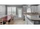 Eat-in kitchen with dining area offering ample seating, natural light, and convenient access to kitchen and patio at 8232 Sunset Hill Rd # Th88, Waxhaw, NC 28173