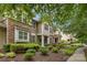 Attractive townhome exterior showcasing a mix of stone and siding, complemented by lush, green landscaping at 8232 Sunset Hill Rd # Th88, Waxhaw, NC 28173