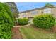 Townhome featuring green bushes and a small lawn, giving privacy to each unit at 8232 Sunset Hill Rd # Th88, Waxhaw, NC 28173