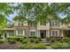 Charming townhome featuring a stone and siding facade, well-manicured landscaping, and inviting entryway at 8232 Sunset Hill Rd # Th88, Waxhaw, NC 28173