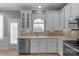 Bright kitchen with stainless steel appliances, white cabinets, and tiled backsplash at 8232 Sunset Hill Rd # Th88, Waxhaw, NC 28173