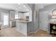 Updated kitchen features white cabinets, stainless steel appliances, and breakfast bar at 8232 Sunset Hill Rd # Th88, Waxhaw, NC 28173