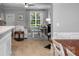 Living room view shows natural light, fireplace and view into dining area at 8232 Sunset Hill Rd # Th88, Waxhaw, NC 28173