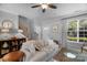 Cozy living room features neutral tones, large window, and hardwood staircase at 8232 Sunset Hill Rd # Th88, Waxhaw, NC 28173