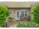 Back patio with outdoor seating and greenery for a relaxing outdoor space at 8232 Sunset Hill Rd # Th88, Waxhaw, NC 28173