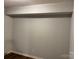 Finished basement with beam and neutral painted walls and wood-look floors at 824 6Th Nw St # 5, Hickory, NC 28601