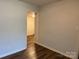 Empty room showing wood-look flooring and view into another room at 824 6Th Nw St # 5, Hickory, NC 28601