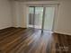 Bedroom featuring luxury vinyl flooring and a sliding door for extra light at 824 6Th Nw St # 5, Hickory, NC 28601