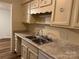 Neutral kitchen with double sink, light countertops and matching cabinetry at 824 6Th Nw St # 5, Hickory, NC 28601