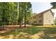 Spacious, grassy backyard with mature trees surrounding the two-story home at 8402 Aspen Ct, Charlotte, NC 28227