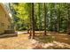 The wooded backyard offers plenty of shade at 8402 Aspen Ct, Charlotte, NC 28227