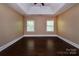 Bright and airy bedroom with trey ceiling and hardwood floors at 8402 Aspen Ct, Charlotte, NC 28227