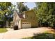 Exterior view of home with driveway leading to the attached garage at 8402 Aspen Ct, Charlotte, NC 28227