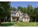 Charming two-story home featuring a well-manicured lawn and inviting curb appeal at 8402 Aspen Ct, Charlotte, NC 28227