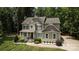Charming two-story home with a welcoming front porch and manicured lawn at 8402 Aspen Ct, Charlotte, NC 28227