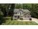 Charming two-story home with a welcoming front porch and manicured lawn at 8402 Aspen Ct, Charlotte, NC 28227