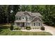 Charming two-story home with a welcoming front porch and manicured lawn at 8402 Aspen Ct, Charlotte, NC 28227