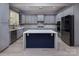 Stylish kitchen features gray cabinets, white countertops, stainless steel appliances, and a center island at 8402 Aspen Ct, Charlotte, NC 28227