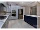 Open concept kitchen with stainless appliances, gas range, and a view into another room at 8402 Aspen Ct, Charlotte, NC 28227